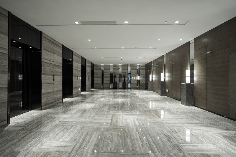 Polished gray tile flooring in a modern commercial interior